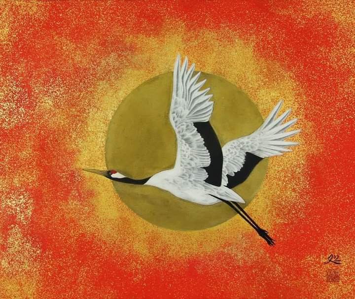 oiseau passant devant le soleil