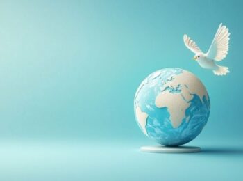 Une colombe survolant un globe terrestre