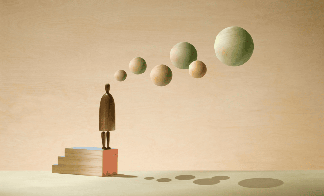 Image 3D d'un personnage sur une estrade et des boules comme sortant de son esprit